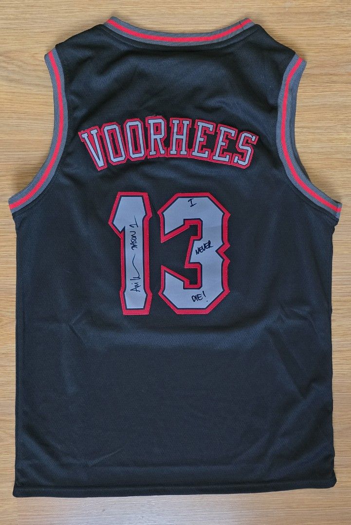 Friday the 13th Jersey (Category: Activewear) located in Manila. Submitted by lustysmile (Listing ID 1464448231, Image 2). Description: - Black basketball jersey with Jason Voorhees mask graphic on front. - Back reads 'Voorhees' and the number '13'. - Special text on the number '13': 'I Never Die!' and 'Austin 1'. - Perfect for horror movie fans and basketball lovers. - Made of comfortable mesh material. - Relaxed fit for easy movement. dimension