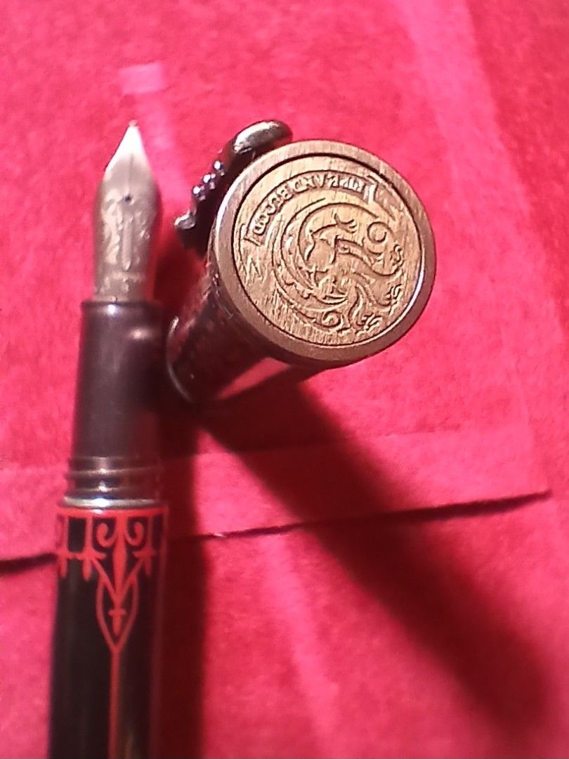 Game of Thrones Fountain Pen (Category: Luxury Accessories) located in Manila. Submitted by bennyald (Listing ID 1464470964, Image 3). Description: Montegrappa Game of Thrones Targaryen fountain pen. Brass body, broad nib. Dragon details on clip and finial..