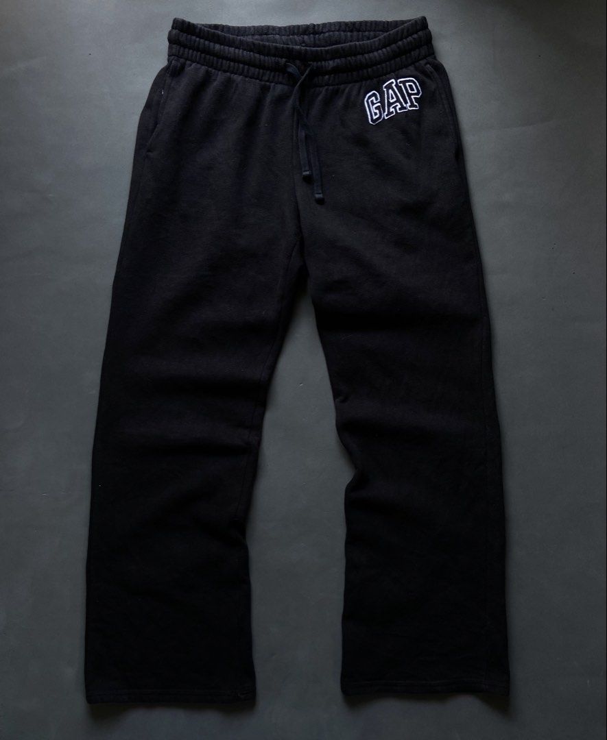GAP Black Sweatpants Joggers with Logo (Category: Joggers) located in Manila. Submitted by seccccction80 (Listing ID 1464430494, Image 1). Description: - Black sweatpants from GAP - Features classic embroidered GAP logo on left thigh - Elastic waistband with adjustable drawstring for a comfortable fit - Made from soft, cozy material - Ideal for lounging or casual everyday wear.