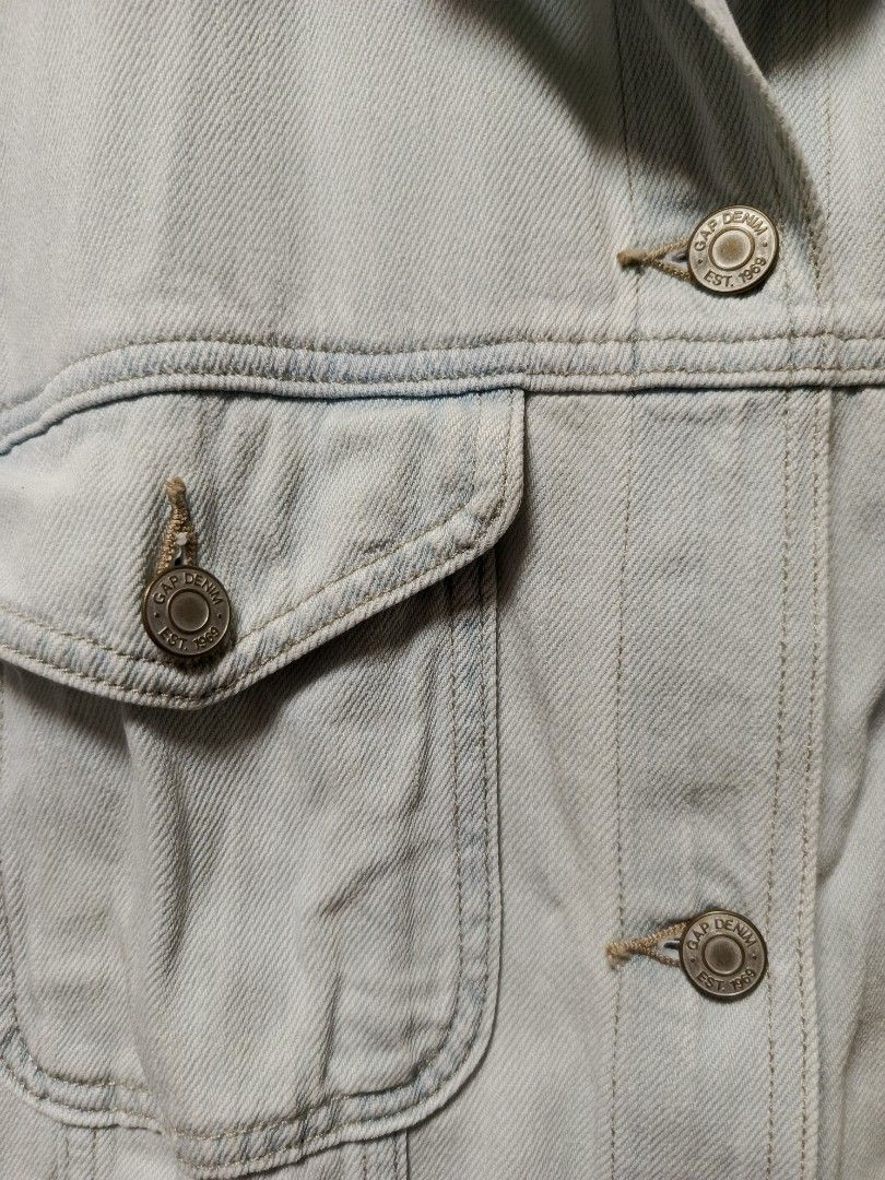 Gap Denim Jacket XL Light Wash Short Sleeve (Category: Coats, Jackets and Outerwear) located in Cabatuan. Submitted by penthegreat (Listing ID 1464568150, Image 3). Description: 22.5 width & 24.5 length 9.5/10 condition - Light wash Gap denim jacket - Short sleeves with rolled cuffs - Classic button-up front - Two chest pockets - Made of 100% cotton - Versatile for layering or wearing alone - Easy to style with any outfit.