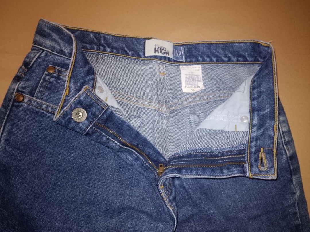 GAP High Waisted Flare Jeans Size 16 (Category: Jeans) located in Quezon City. Submitted by macieee39997 (Listing ID 1464453665, Image 3). Description: - Classic blue wash GAP jeans - High-waisted fit - Flare leg - Button and zip front closure - Two back pockets, two front pockets - Made from durable denim - Great for everyday wear.
