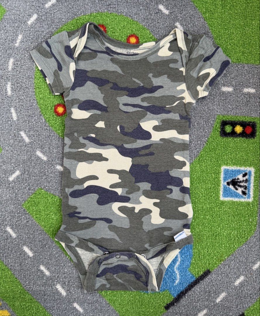 Gerber Camouflage Short Sleeve Onesie (Category: Babies & Kids Fashion) located in Rizal. Submitted by preloovved (Listing ID 1464463975, Image 1). Description: Cute Gerber camo onesie, short sleeves. Easy snaps. Soft fabric. Gerber camo onesie. Short sleeves, snap closure. Soft and comfy for everyday wear. Preloved, 12mos Meet-up only in GB1 San Mateo, Rizal Shipping fee c/o buyer. Tres Marias or J&T express Payment to be sent to me via BPI/BDO/