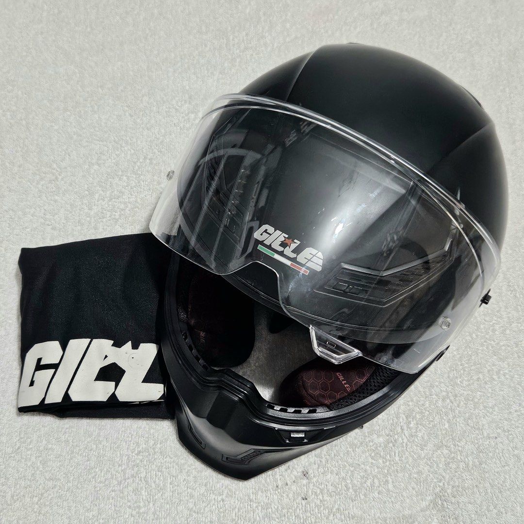Gille Full Face Helmet (Category: Helmets and other Riding Gears) located in Pasig City. Submitted by ela_zen15 (Listing ID 1464405781, Image 1). Description: Gille Full Face Helmet Features: Full Face Dual Visor ABS & Synthetic Unisex Light Weight Good Ventilation Intercom Space Removable Lining for Wash Size: Medium (56-58cm) Matte Black With Box, Dust Bag, Clear Lens, Tinted Lens RFS: Di na po nagagamit kasi naka ebike na. Walang Crack. Walang
