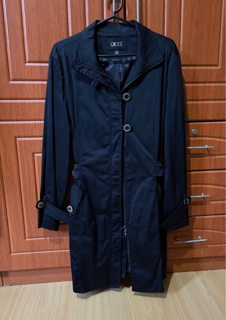 Gitti Black Trench Coat Small - Large (Category: Coats, Jackets and Outerwear) located in Quezon City. Submitted by garagesale2026 (Listing ID 1464566004, Image 1). Description: - Preloved - In good condition - Dry clean maintained - Size 3 on tag, fits up to Large - WAist: 37.5"; Length: 34.5".