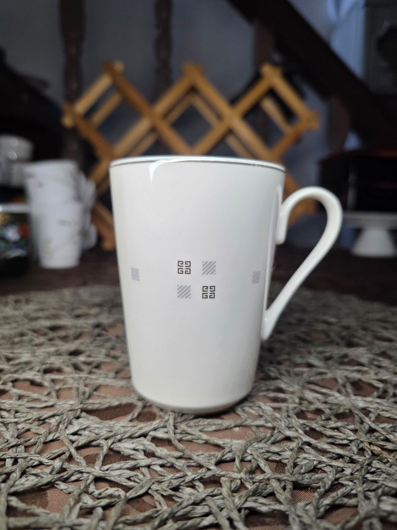 Givenchy mug (Category: Coffee & Tea Tableware) located in Zamboanga. Submitted by lunavinum (Listing ID 1464448820, Image 1). Description: Givenchy Japan Mug Approx meas: 3x4 inches Condition: Minor silver rub 220.
