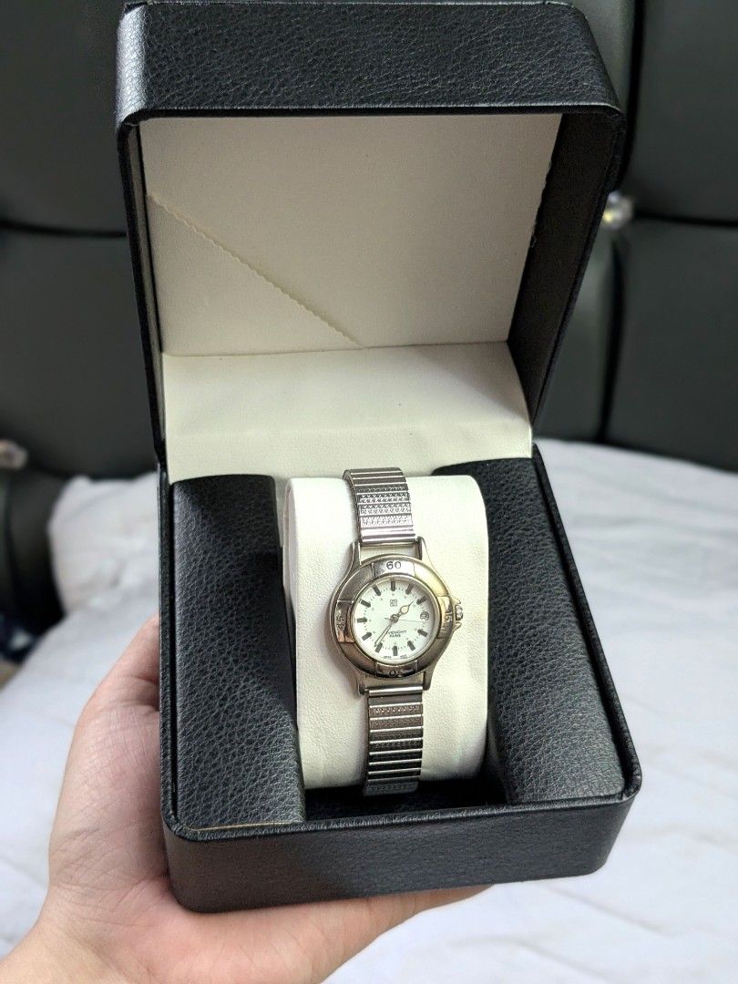 Givenchy Royal Sport Watch (Category: Luxury Watches) located in Quezon City. Submitted by nnncorner (Listing ID 1464437799, Image 1). Description: Original Givenchy Life Royal Sport Vintage Timepiece Watch Stretchable Band Strap 5 peso coin size dial Fits wrist 17-22cm 8.9/10 condition Has date window No scratches or hairlines on glass face All parts are original Water Resistant Japan Movement 100% working and no need new battery With replacemen