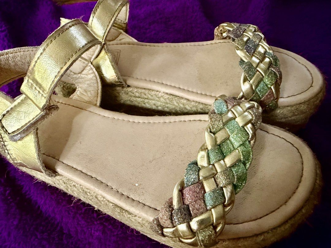 Gold Espadrille Platform Sandals with Braided Straps (Category: Flats & Sandals) located in Oroquieta. Submitted by yenz.preloved (Listing ID 1464432905, Image 2). Description: - Stylish gold espadrille sandals - Braided strap with gold, green, and pink glittery threads - Comfortable platform sole - Secure ankle buckle closure - Made in China - Insole is 21cm. .