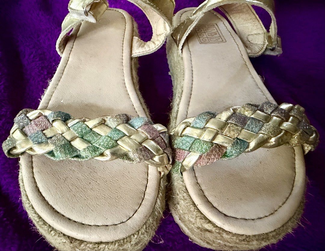 Gold Espadrille Platform Sandals with Braided Straps (Category: Flats & Sandals) located in Oroquieta. Submitted by yenz.preloved (Listing ID 1464432905, Image 3). Description: - Stylish gold espadrille sandals - Braided strap with gold, green, and pink glittery threads - Comfortable platform sole - Secure ankle buckle closure - Made in China - Insole is 21cm. .