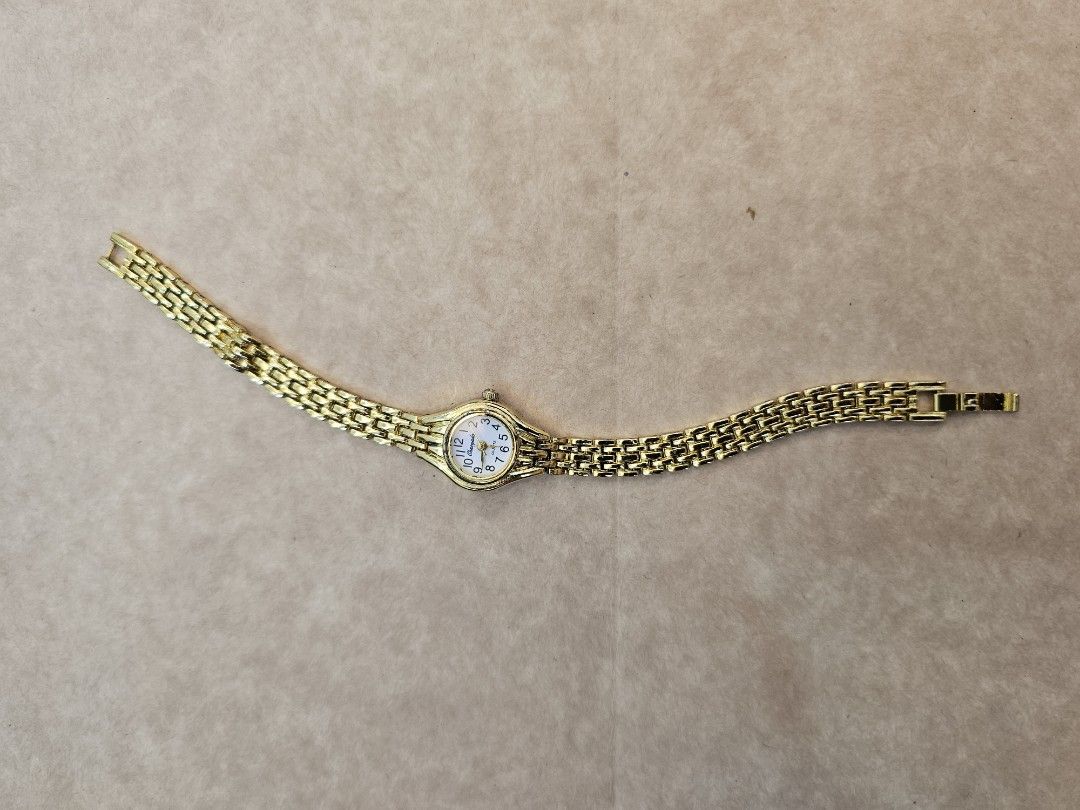 Gold Tone Analog Watch (Category: Women's Watches) located in Manila. Submitted by john.tulalian (Listing ID 1464407409, Image 2). Description: - Gold tone analog watch - White face with gold hour markers - Classic link bracelet - Clasp closure - Simple and timeless design - Ideal for everyday wear -Negotiable -Price+Sf.