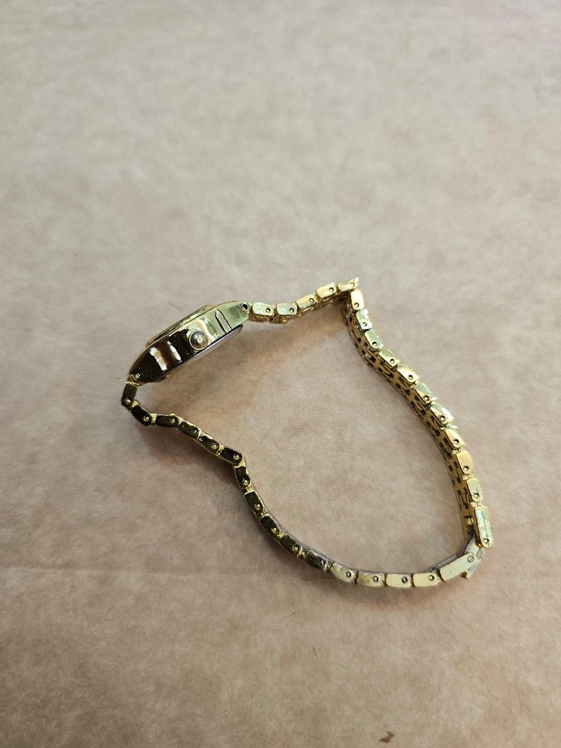 Gold Tone Analog Watch (Category: Women's Watches) located in Manila. Submitted by john.tulalian (Listing ID 1464407409, Image 3). Description: - Gold tone analog watch - White face with gold hour markers - Classic link bracelet - Clasp closure - Simple and timeless design - Ideal for everyday wear -Negotiable -Price+Sf.