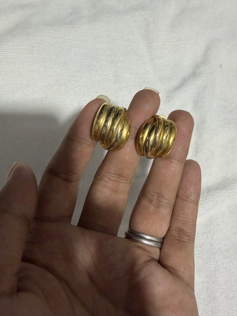 Gold Tone Clip-On Earrings Set (Category: Earrings) located in Digos. Submitted by old_soul. (Listing ID 1464498878, Image 2). Description: - Two pairs of gold tone clip-on earrings - Pair 1: Circular design with a ball accent - Pair 2: Ribbed, curved design - All pieces are clip-on style - Adds a vintage flair to any outfit.
