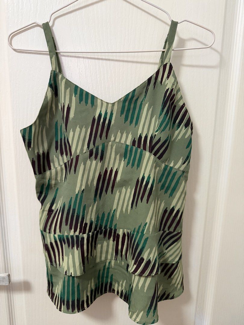Green Camisole Top with Abstract Print (Category: Sleeveless) located in Cebu City. Submitted by belleskie98 (Listing ID 1464388140, Image 2). Description: - Cute green camisole top - Features an abstract dash print in green and dark purple - Smocked bust detail - Ruffled hemline - Adjustable straps - Great for casual wear or layering.