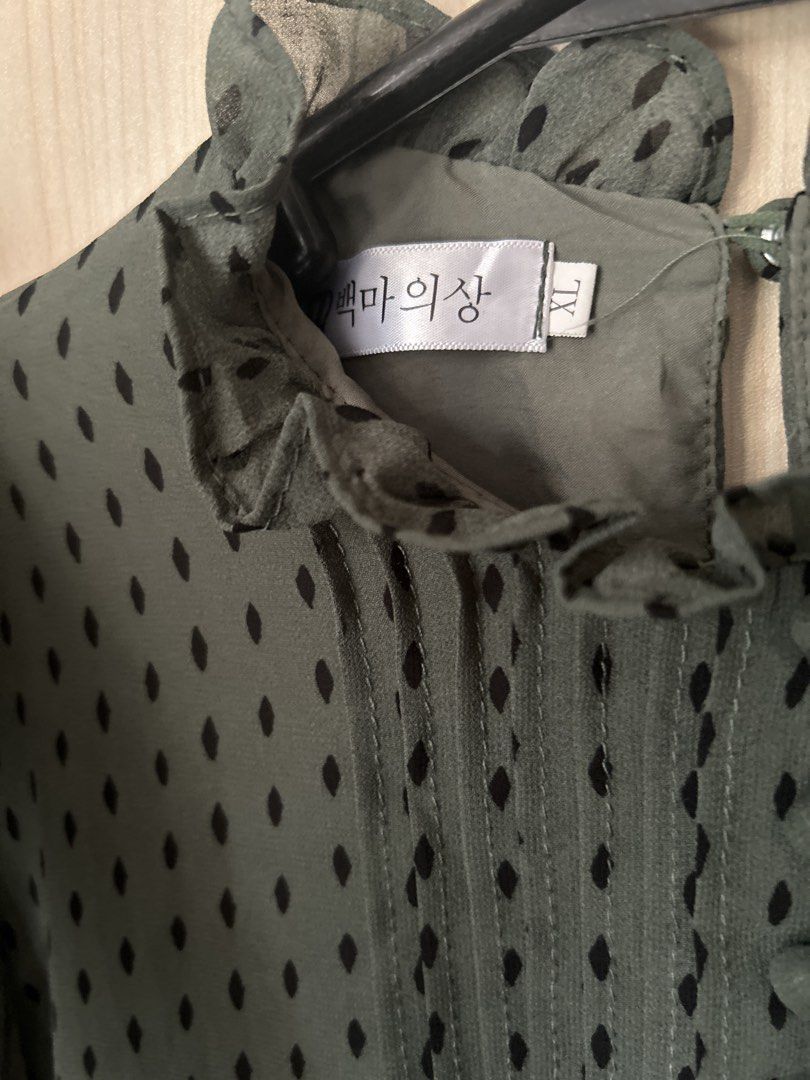 Green Polka Dot Ruffle Neck Blouse XL (Category: Blouses) located in Pasig City. Submitted by closet4hope (Listing ID 1464405784, Image 2). Description: - Green long-sleeved blouse - Black polka dot pattern - Ruffled neckline - Button-up front - Button cuffs on sleeves - Tagged size XL - Perfect for dressing up or down 14 inches 24.5 inches.
