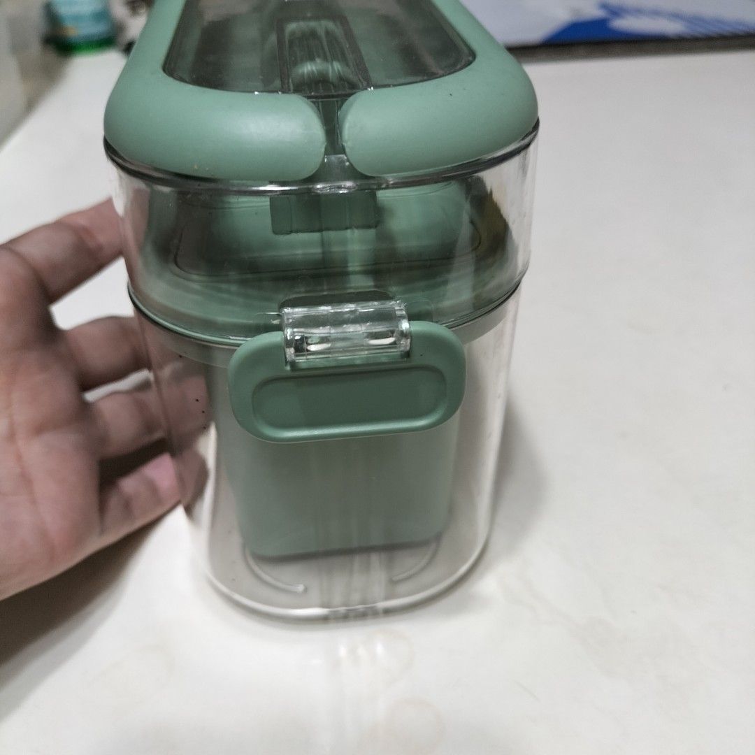 Green Popsicle Molds Ice Cream Maker with Container (Category: Food Organization & Storage) located in Paranaque City. Submitted by decluttering-all (Listing ID 1464566676, Image 3). Description: - Create your own delicious popsicles at home! - Set includes 6 individual popsicle molds. - Comes with a convenient container to keep molds organized in the freezer. - Simple to use and easy to clean. - Perfect for refreshing summer treats and experimen
