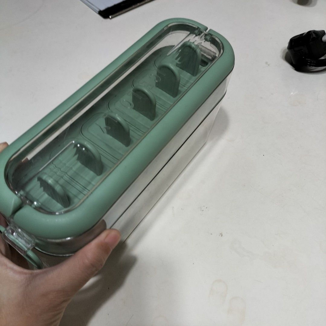Green Popsicle Molds Ice Cream Maker with Container (Category: Food Organization & Storage) located in Paranaque City. Submitted by decluttering-all (Listing ID 1464566676, Image 2). Description: - Create your own delicious popsicles at home! - Set includes 6 individual popsicle molds. - Comes with a convenient container to keep molds organized in the freezer. - Simple to use and easy to clean. - Perfect for refreshing summer treats and experimen