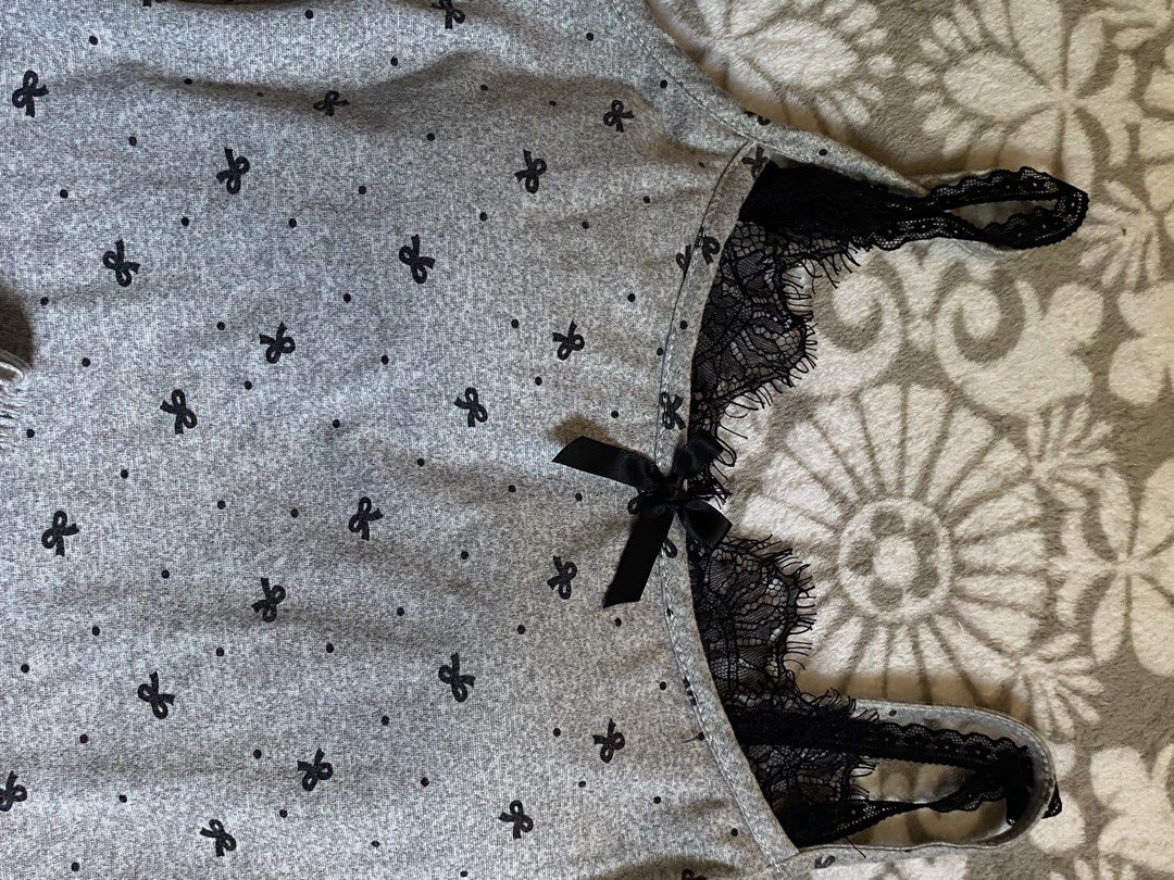 Grey Bow Pajama Set with Lace Trim (Category: Undergarments & Loungewear) located in Manila. Submitted by mysticcat15 (Listing ID 1464503750, Image 2). Description: mop: gcash/bank transfer mod: jnt - Cute grey pajama set - All-over small black bow pattern - Black lace trim on neckline and straps - Cami features a small black bow in the center - Matching shorts with black bows on each side - Comfortable and stylish sleepwear.