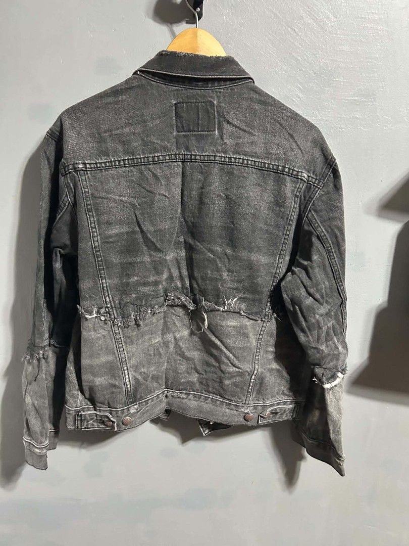 Grey Distressed Denim Jacket with Raw Hem (Category: Coats, Jackets and Outerwear) located in Manila. Submitted by marjoriete27817 (Listing ID 1464372314, Image 2). Description: - Cool grey R13 distressed denim jacket - Raw edges at hem and cuffs - Button-up front with chest pockets - Unique layered sleeve design - Ideal for layering over tees or hoodies -size large 22*24 - Adds a unique style to your wardrobe.