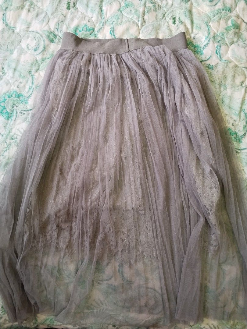 Grey Tulle Lace Maxi Skirt (Category: Skirts) located in Rizal. Submitted by gentlebear-6e31 (Listing ID 1464441549, Image 2). Description: - Elegant long grey tulle skirt - Features a delicate lace underlay - Comfortable elastic waistband - Perfect for dressing up or down - Looks lovely with a simple top - Ideal for special events or casual outings.