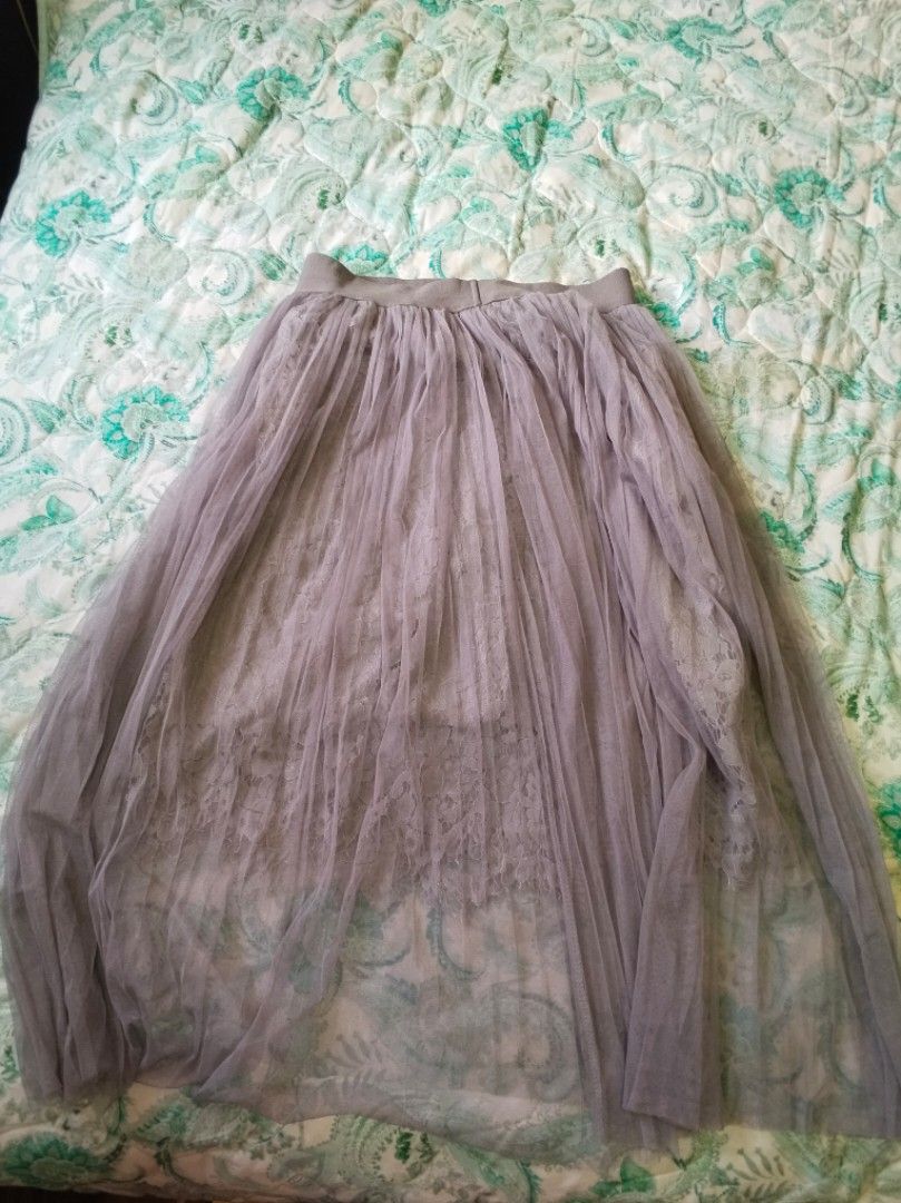 Grey Tulle Lace Maxi Skirt (Category: Skirts) located in Rizal. Submitted by gentlebear-6e31 (Listing ID 1464441549, Image 1). Description: - Elegant long grey tulle skirt - Features a delicate lace underlay - Comfortable elastic waistband - Perfect for dressing up or down - Looks lovely with a simple top - Ideal for special events or casual outings.