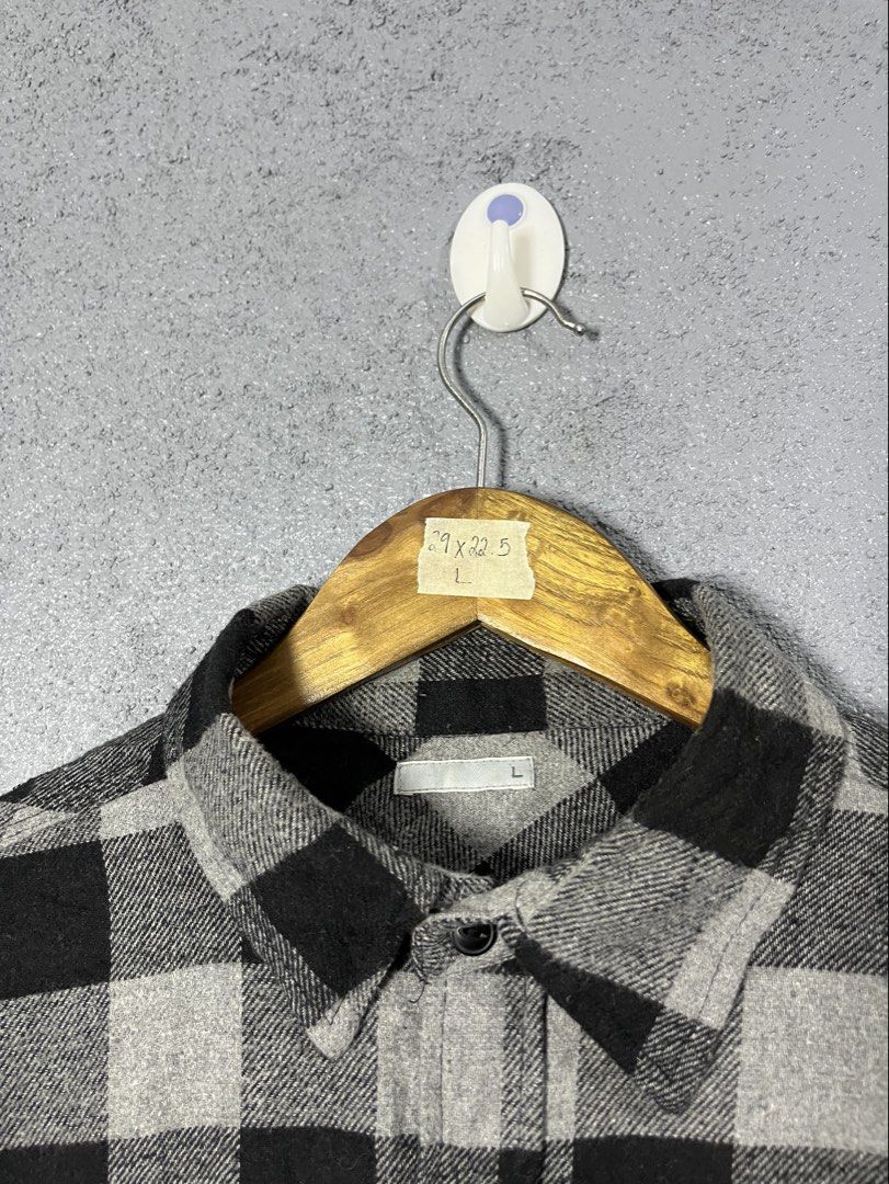 GU Flannel Checkered Shirt Size L (Category: Tshirts & Polo Shirts ) located in Famy. Submitted by basicthrifted (Listing ID 1464530264, Image 3). Description: - Classic black and grey checkered flannel shirt from Uniqlo. - Features two chest pockets with button closure. - Full button-up front. - Made from a comfortable polyester and rayon blend. - Versatile for layering or wearing as a standalone piece..