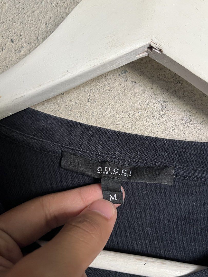Gucci Black Logo Tee (Category: Luxury Apparel) located in Adams. Submitted by princess.maggie (Listing ID 1464397799, Image 3). Description: - 19 x 27 - complete tags - no issue.