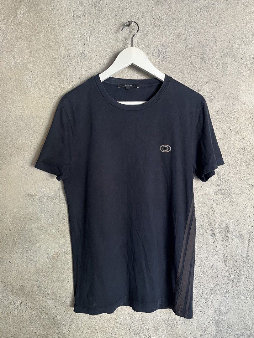 Gucci Black Logo Tee (Category: Luxury Apparel) located in Adams. Submitted by princess.maggie (Listing ID 1464397799, Image 1). Description: - 19 x 27 - complete tags - no issue.