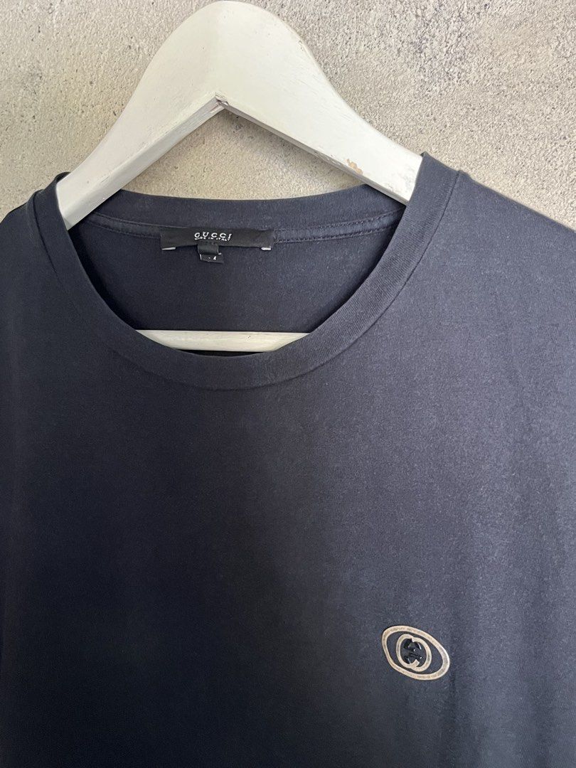 Gucci Black Logo Tee (Category: Luxury Apparel) located in Adams. Submitted by princess.maggie (Listing ID 1464397799, Image 2). Description: - 19 x 27 - complete tags - no issue.