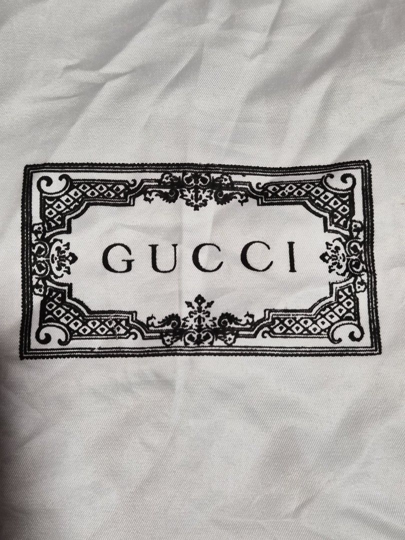 Gucci Dust Bag 13×11 inches (Category: Luxury Bags & Wallets) located in Mandaue City. Submitted by chuchi152615 (Listing ID 1464404462, Image 2). Description: - Gucci dust bag - White fabric with black Gucci logo - Ideal for storing handbags or shoes - Protects your valuables - Approximate dimensions: 13" x 16" - Clean and ready for use.