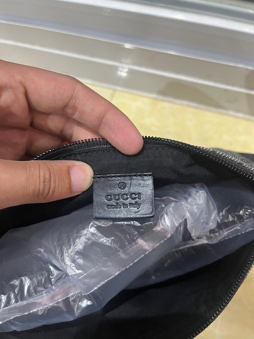 Gucci GG Monogram Denim Pouch Bag (Category: Luxury Bags & Wallets) located in Caloocan City. Submitted by pumarenluc79160 (Listing ID 1464392858, Image 3). Description: - Authentic Gucci pouch bag - Classic GG monogram pattern on denim - Gold tone hardware - Zipper closure - Made in Italy - Interior Gucci leather tag with serial number 0719c 2123 - Ideal for carrying essentials.