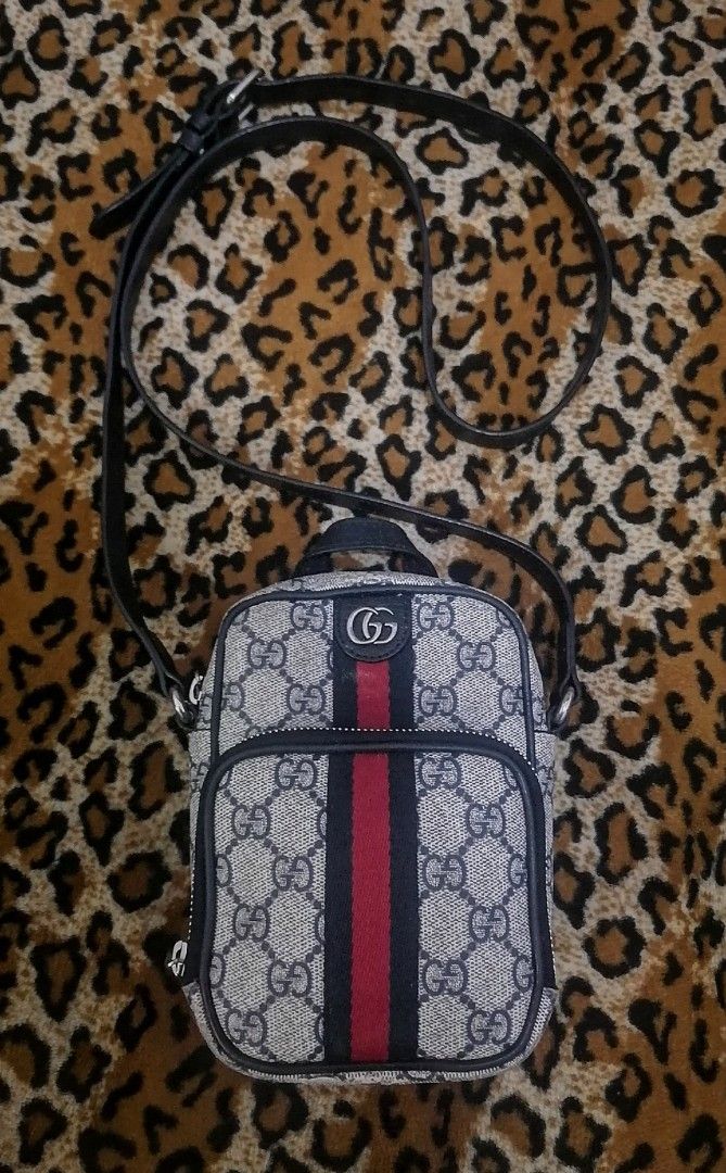 Gucci Ophidia GG Supreme Mini Bag (Category: Luxury Bags & Wallets) located in Cebu City. Submitted by roadthrift (Listing ID 1464385059, Image 1). Description: - Authentic Gucci mini crossbody bag - Classic GG monogram canvas - Signature red and blue web stripe - Secure zipper closure - Adjustable strap for comfortable wear - Small top handle for versatility - Ideal size for carrying essentials.