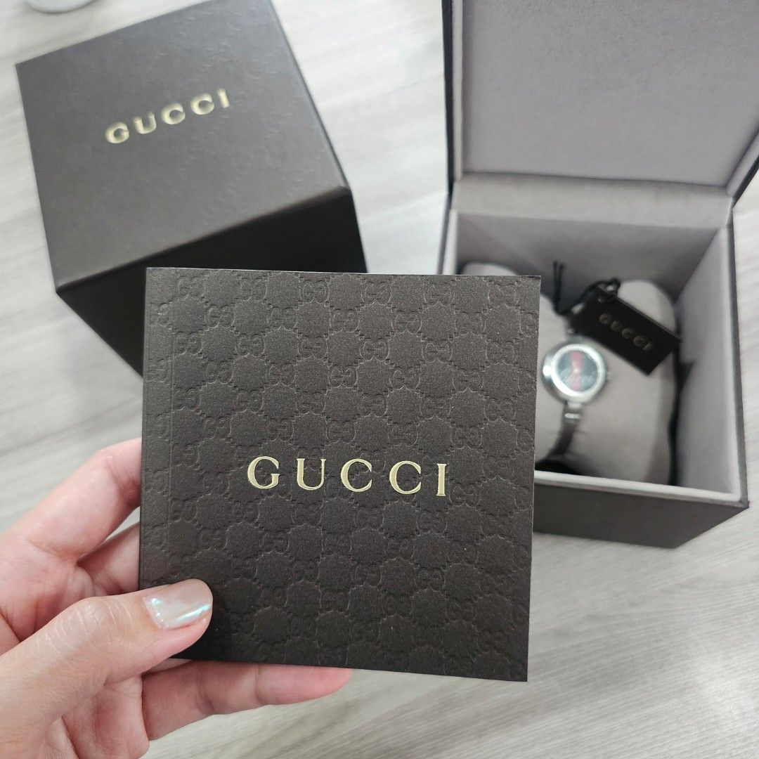 Gucci Watch YA105221 (Category: Luxury Watches) located in Quezon City. Submitted by innactln (Listing ID 1464389664, Image 2). Description: - Authentic Gucci Watch - Model: YA105221 - Band: Silver - Face: Round with green and red Gucci logo - Includes: Original box and tags - Serial Number: SN 13031820 - Condition: Great accessory.