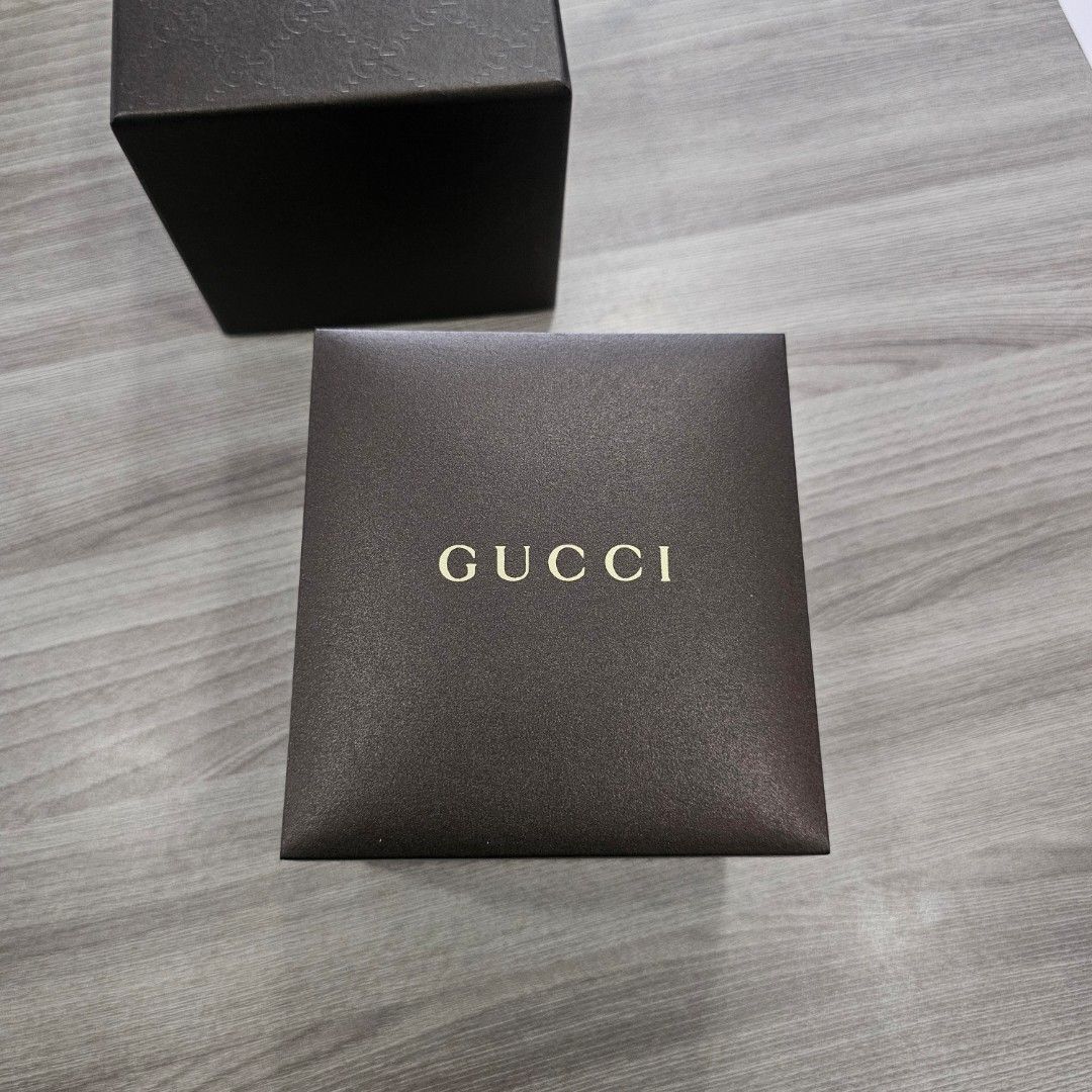 Gucci Watch YA105221 (Category: Luxury Watches) located in Quezon City. Submitted by innactln (Listing ID 1464389664, Image 1). Description: - Authentic Gucci Watch - Model: YA105221 - Band: Silver - Face: Round with green and red Gucci logo - Includes: Original box and tags - Serial Number: SN 13031820 - Condition: Great accessory.