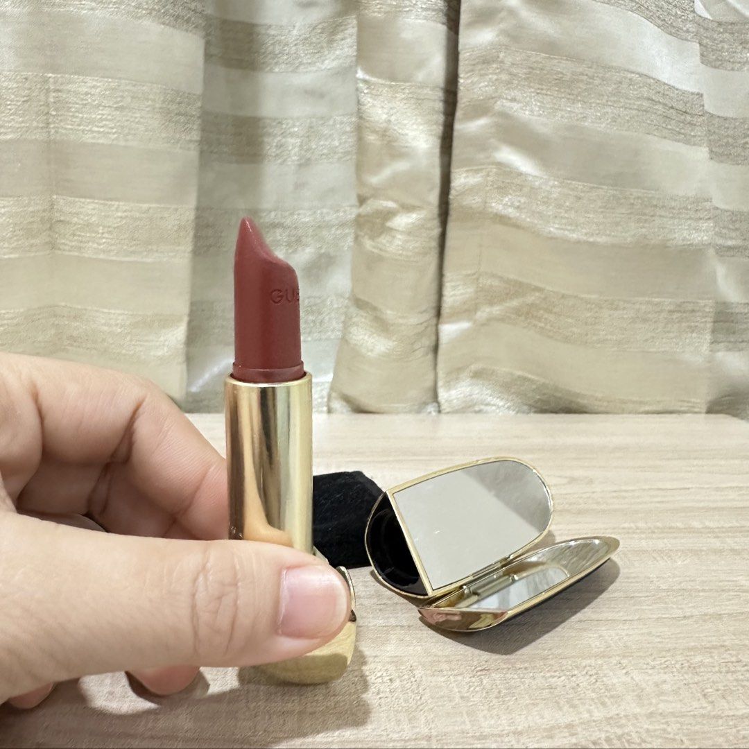 Guerlain Rouge G Lipstick with Case and Mirror (Category: Makeup) located in Paranaque City. Submitted by changingclassic (Listing ID 1464470884, Image 2). Description: Authentic Guerlain lipstick - Beautiful muted berry shade - Elegant gold case with unique textured design - Includes original black velvet pouch - Built-in compact mirror for convenient touch-ups.