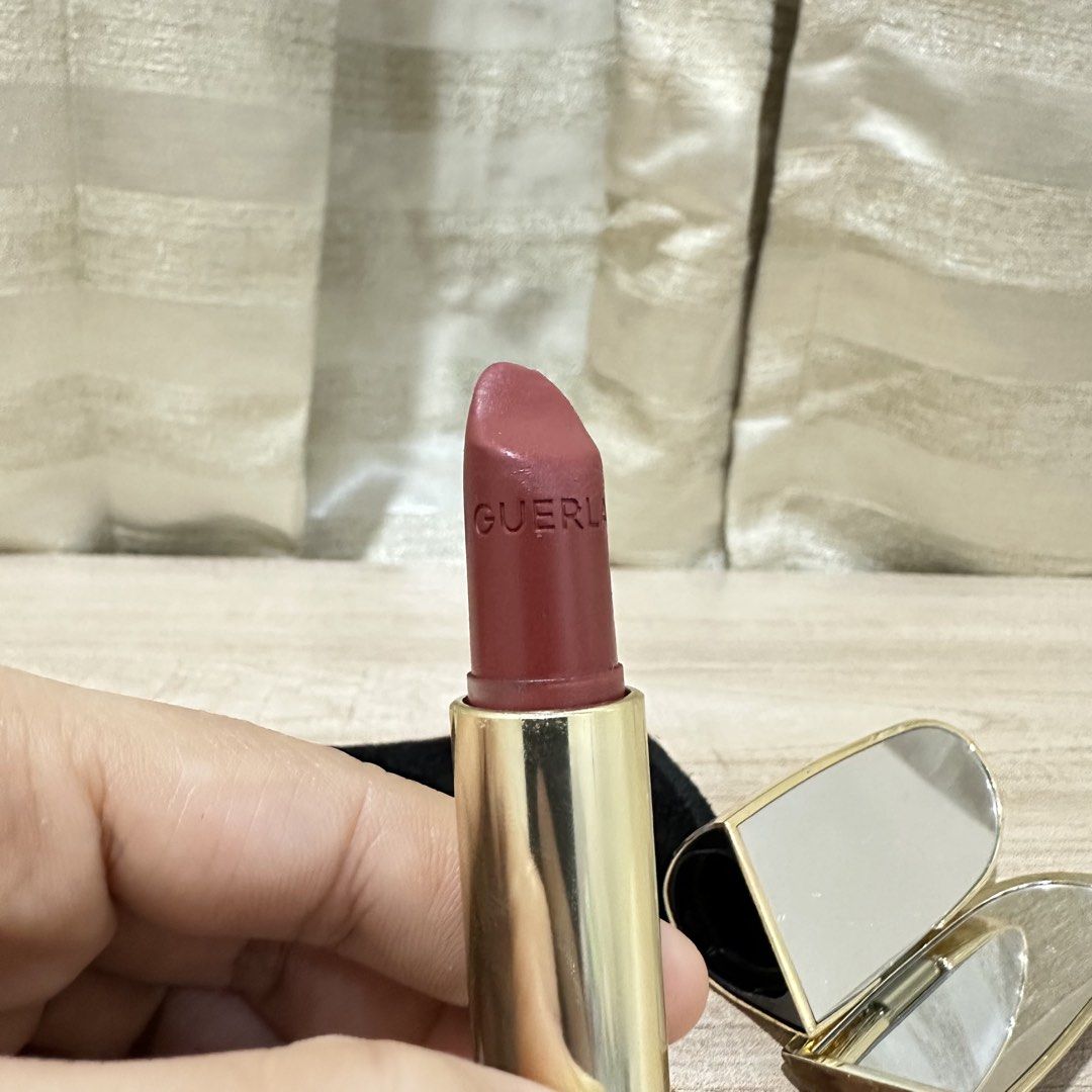 Guerlain Rouge G Lipstick with Case and Mirror (Category: Makeup) located in Paranaque City. Submitted by changingclassic (Listing ID 1464470884, Image 3). Description: Authentic Guerlain lipstick - Beautiful muted berry shade - Elegant gold case with unique textured design - Includes original black velvet pouch - Built-in compact mirror for convenient touch-ups.
