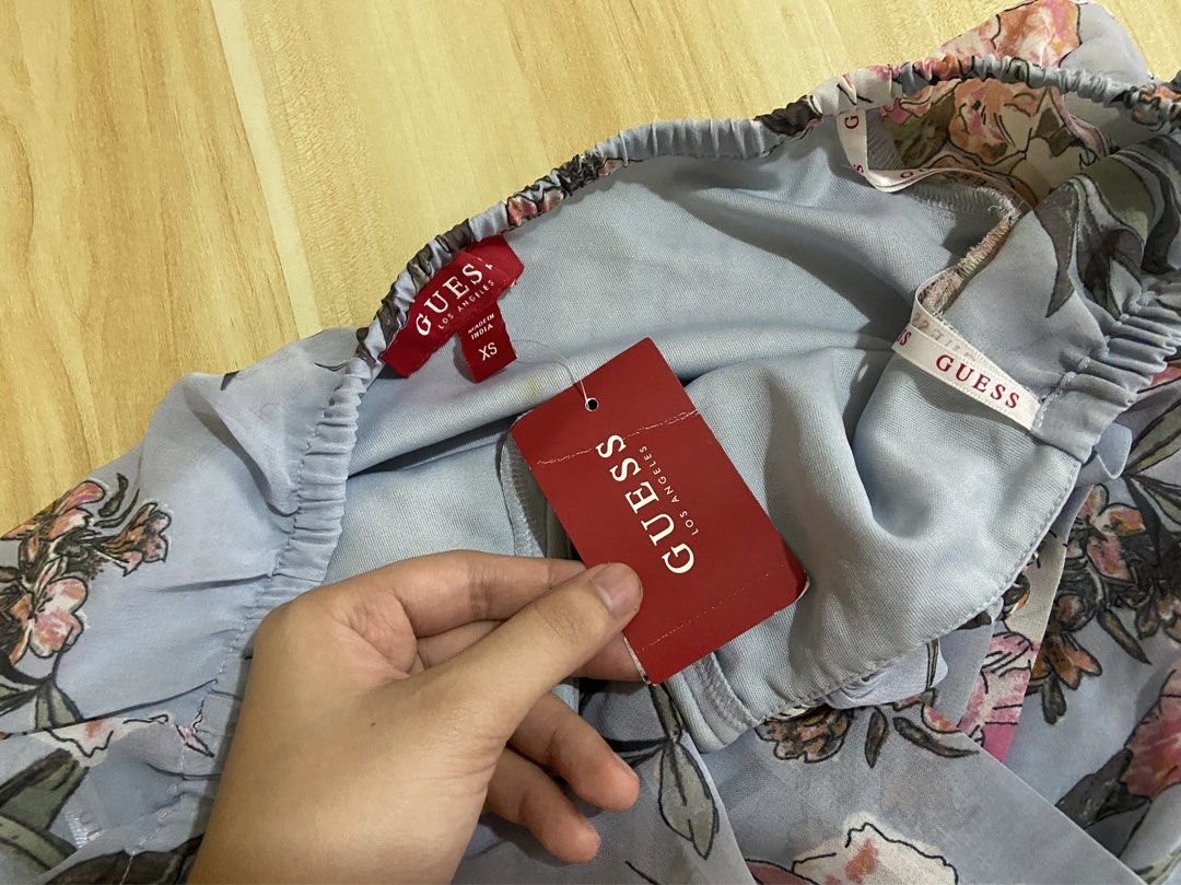 GUESS Authentic Off- Shoulder Floral Bodysuit (Category: Bikinis & Swimsuits) located in Guinobatan. Submitted by jadieee_young22 (Listing ID 1464409656, Image 3). Description: - never used - quality still very nice! - 100% authentic! with Guess tag - bought from canada 🇨🇦 - fits XS as seen in the 2nd picture - long sleeves, draped chiffon wrap front - adjustable 3-snap closure at the bottom for easy wear - color: light blue- floral - check the