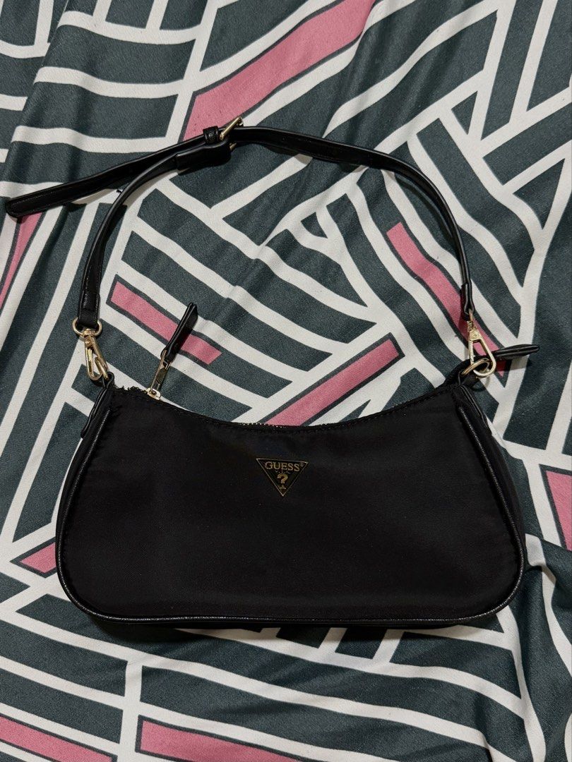Guess Black Nylon Shoulder Bag (Category: Shoulder Bags) located in Quezon City. Submitted by naptimeph (Listing ID 1464546841, Image 2). Description: Includes detachable long strap and shorter shoulder strap NO ISSUE USED ONCE Rfs: Decluttering .
