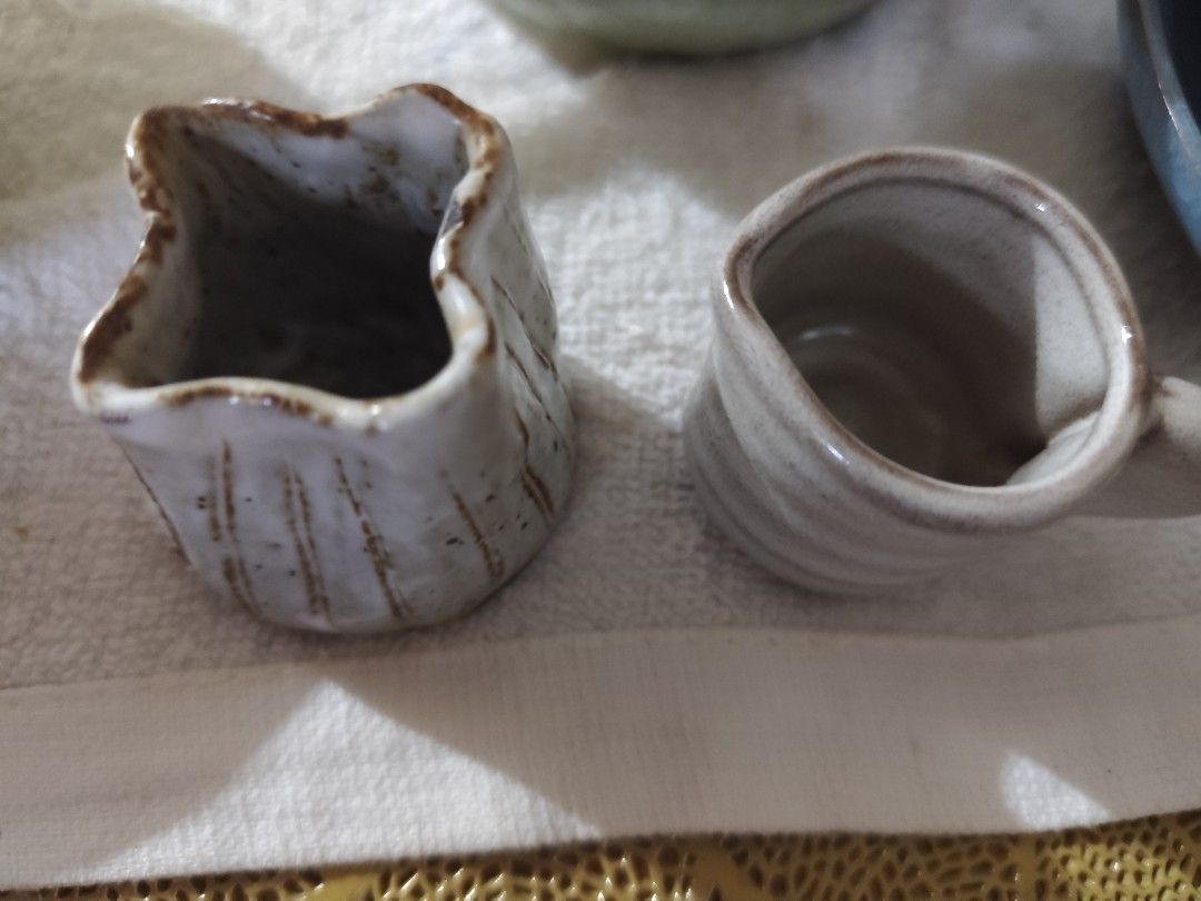 Handmade Ceramic Creamer Pitcher and Small Cup (Category: Coffee & Tea Tableware) located in Manila. Submitted by marriage031073advocate (Listing ID 1464420564, Image 1). Description: - Set includes one ceramic creamer pitcher with handle and one unique jug. - Rustic, handmade aesthetic. - Features a light glaze with charming brown speckles. - Ideal for serving cream, sauces, or as unique kitchen decor..
