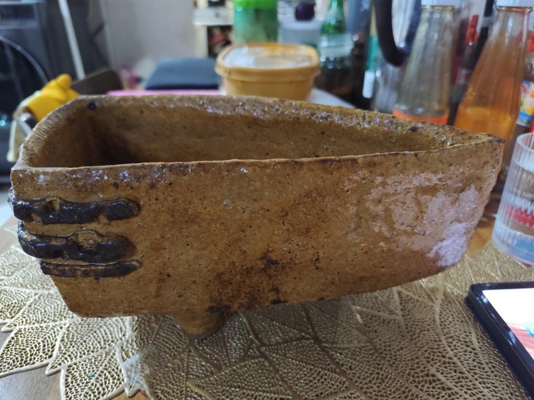 Handmade Ceramic Pot with Feet (Category: Pots & Planters) located in Manila. Submitted by marriage031073advocate (Listing ID 1464421988, Image 3). Description: - Unique handmade ceramic pot - Earthy brown color with speckled details - Three small feet at the base - Ideal for small plants or as a decorative piece - Approximate dimensions: [insert dimensions here if known].