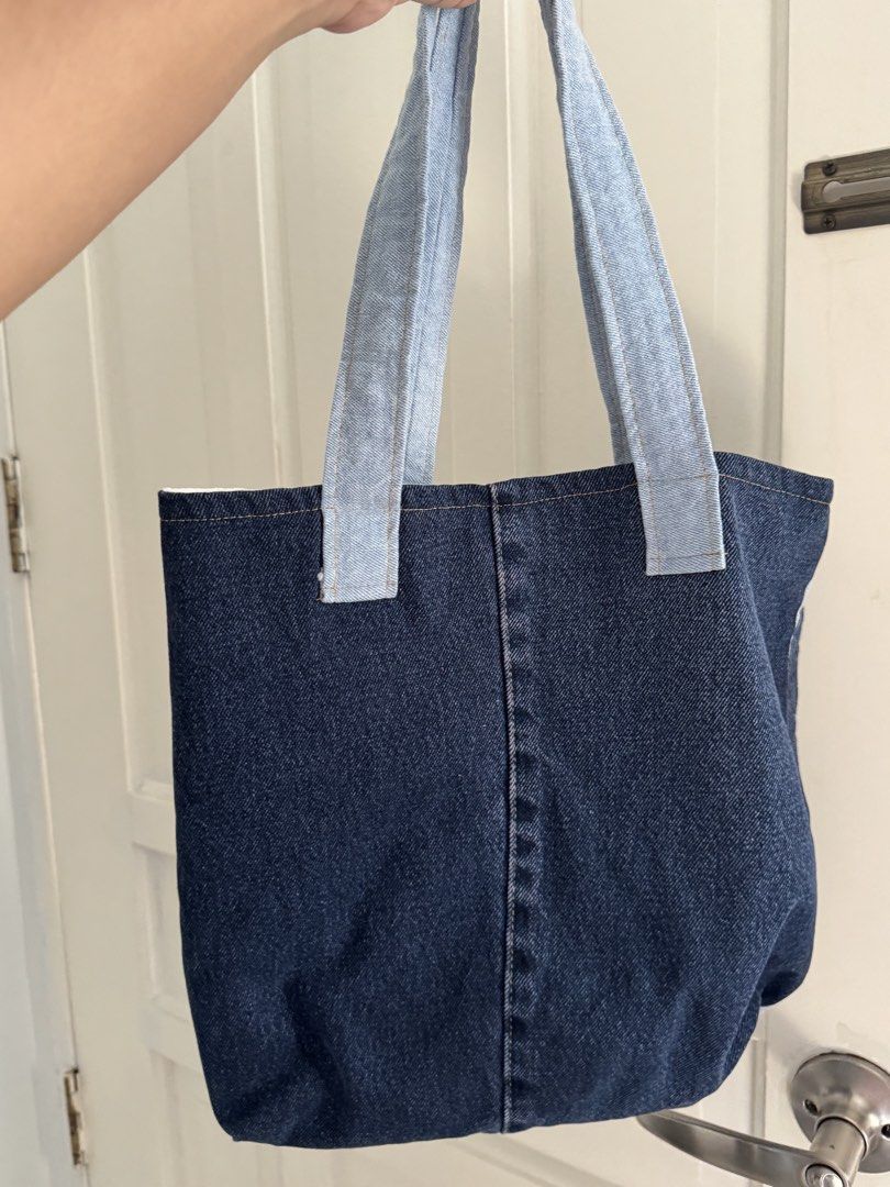 Upcycled Denim Patchwork Tote Bag (Category: Tote Bags) located in Pasay City. Submitted by margucci_0823 (Listing ID 1464411378, Image 2). Description: - Upcycled denim bag - Nin&Yang inspired!! - White fabric lining inside with a convenient denim pocket - Very sturdy!!! and comfortable handles - No zipper/button; open-style Delivery shouldered by buyer via Lalamove 📍Betterliving, Pque .