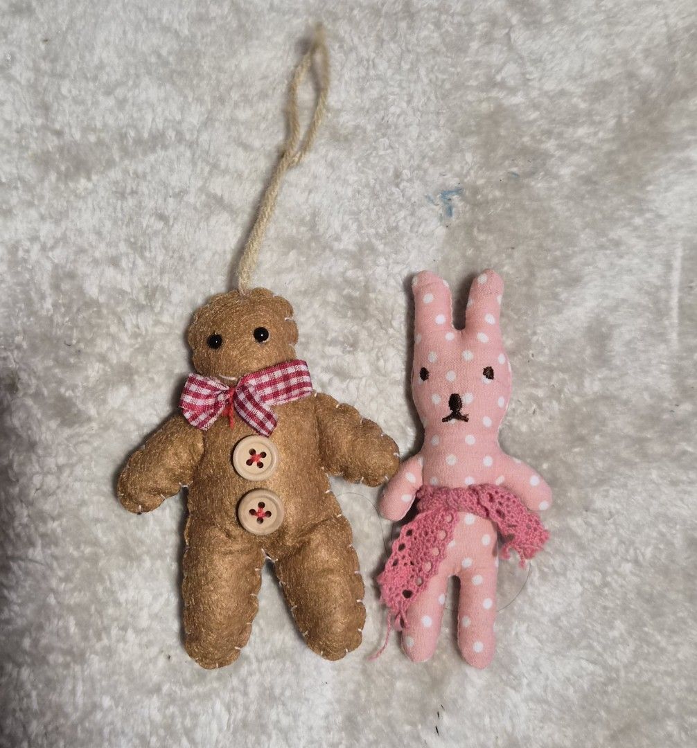 Handmade Gingerbread Man & Bunny Plush Ornaments (Category: Plushies & Soft Toys) located in Mandaue City. Submitted by chuchi152615 (Listing ID 1464404112, Image 2). Description: - Adorable handmade plush ornaments - Gingerbread man: features buttons and a red gingham bow, includes a hanging loop - Pink bunny: adorned with white polka dots and a pink lace skirt, has a clip on the back - Perfect for festive decorations or as a charming small gift