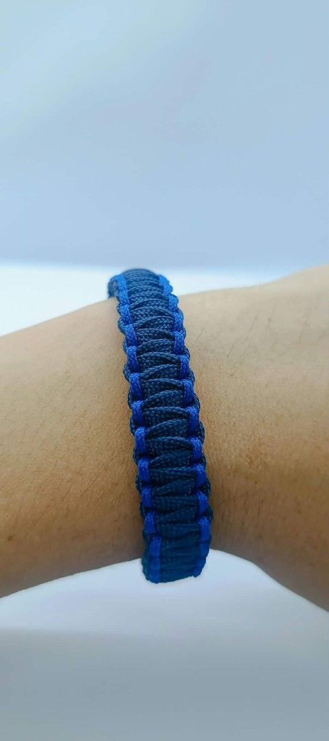 Handmade Paracord Bracelet - Blue & Black (Category: Bracelets) located in Manila. Submitted by kokop3 (Listing ID 1464562333, Image 1). Description: - Cool handmade paracord bracelet - Braided design in dark blue with lighter blue accents - Plain black option also available - Secure knot closure - Great for everyday wear or outdoor activities - Durable and stylish.