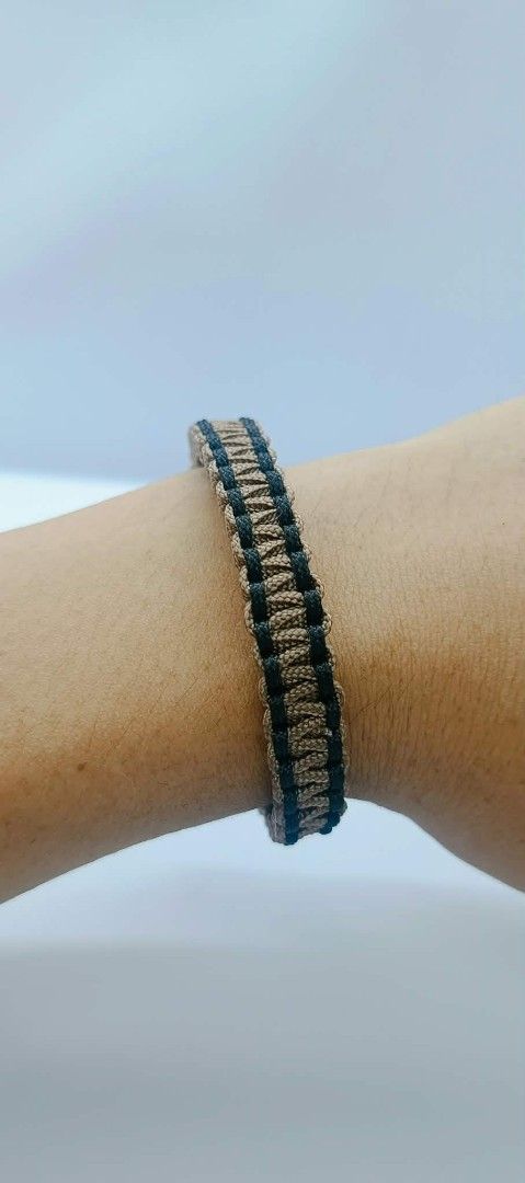 Handmade Paracord Bracelets - Multiple Colors Available (Category: Bracelets) located in Manila. Submitted by kokop3 (Listing ID 1464562479, Image 2). Description: - Handmade paracord bracelets - Available in Tan & Black or Red & Blue - Durable paracord construction - Secure knot closure - Ideal for everyday wear and outdoor adventures - Unique accessory.