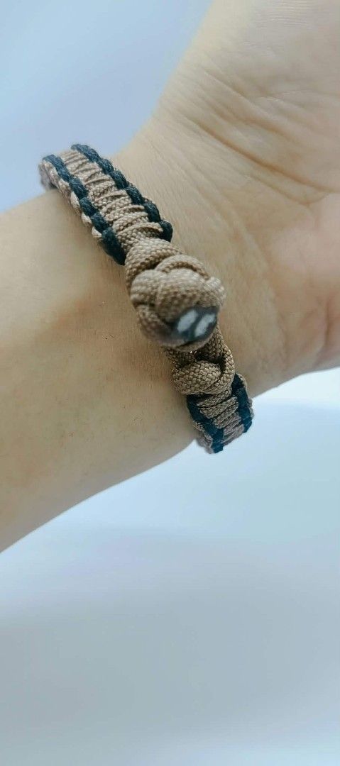 Handmade Paracord Bracelets - Multiple Colors Available (Category: Bracelets) located in Manila. Submitted by kokop3 (Listing ID 1464562479, Image 3). Description: - Handmade paracord bracelets - Available in Tan & Black or Red & Blue - Durable paracord construction - Secure knot closure - Ideal for everyday wear and outdoor adventures - Unique accessory.