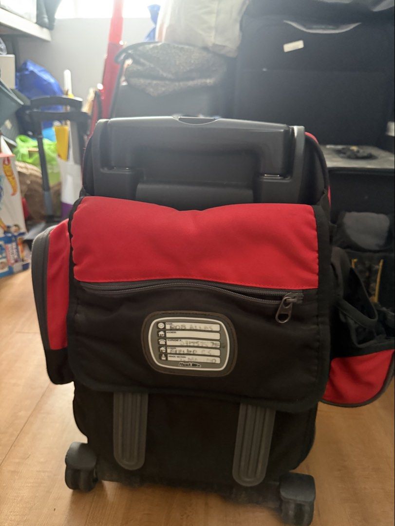 Hawk Red & Black Rolling Backpack Luggage (Category: Backpacks) located in Quezon City. Submitted by krisallie (Listing ID 1464460335, Image 2). Description: - Red and black rolling backpack - Retractable handle and wheels for easy transport - Multiple compartments and pockets for organization - Side mesh pocket for water bottle - Ideal for travel or school - Shows some signs of wear, but fully functional.