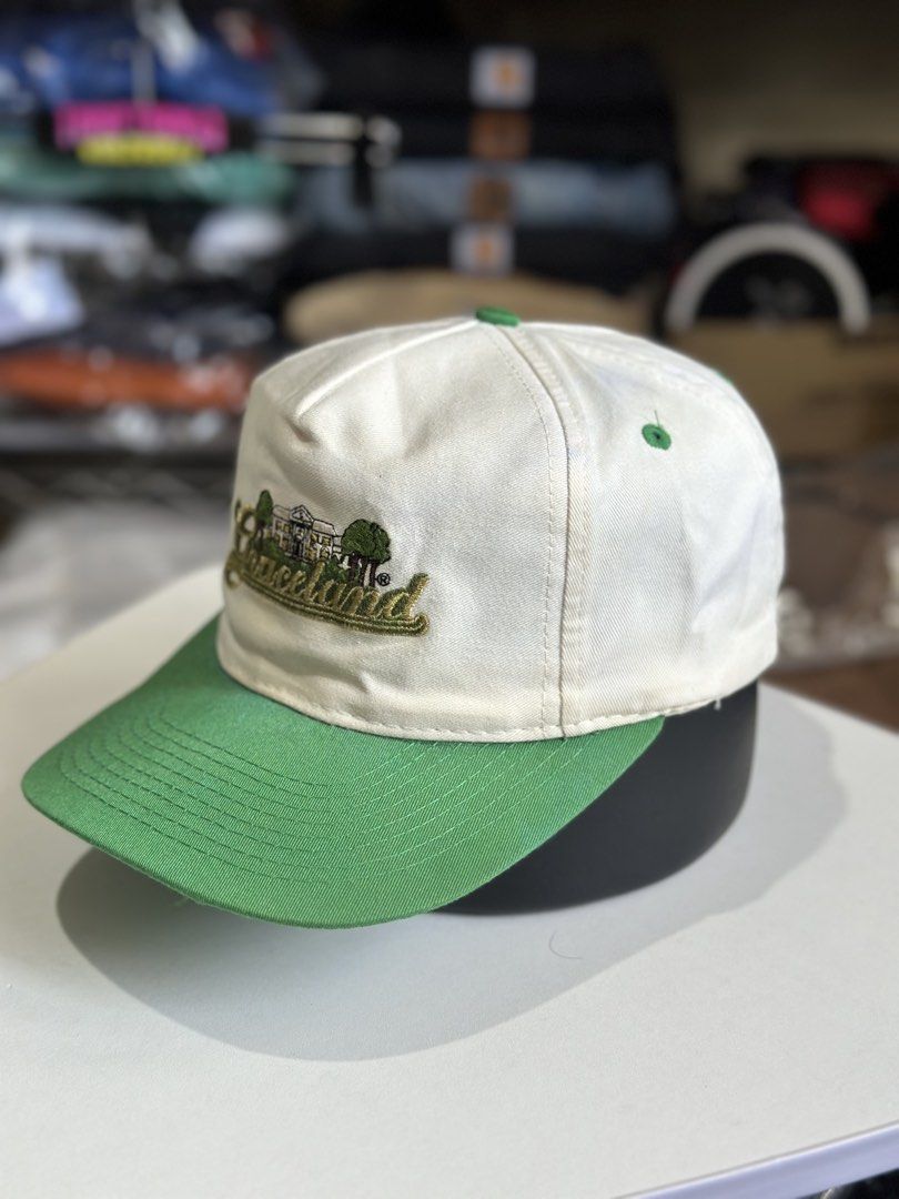 Head To Toe Graceland Embroidered Baseball Cap (Category: Caps & Hats) located in Daet. Submitted by thrifthings2018 (Listing ID 1464419879, Image 2). Description: - White and green baseball cap - Embroidered Graceland logo with trees and building - Adjustable strap at the back (Size-A-Just) - Brand: Head To Toe - Perfect for Graceland fans and collectors - Shows minor signs of wear.