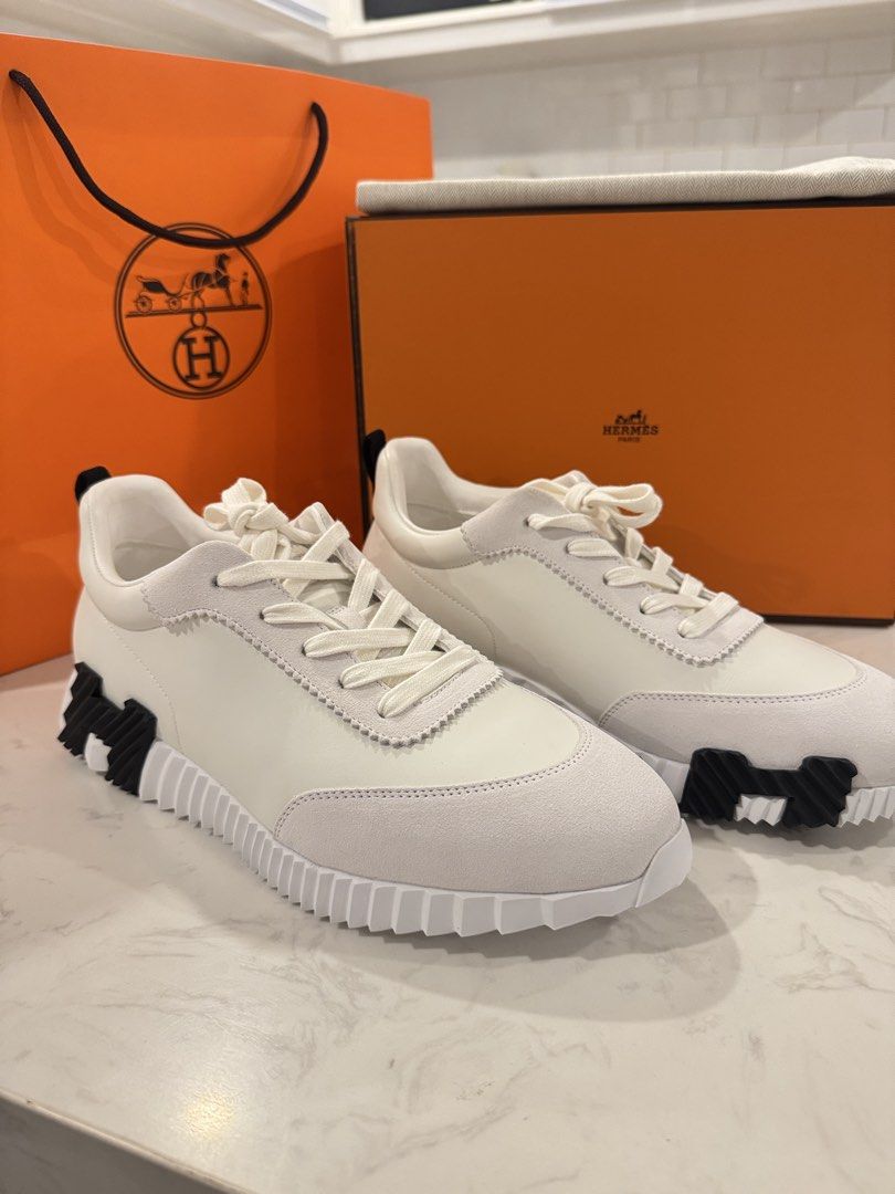 Hermes Bouncing Sneakers (Category: Sneakers) located in Baguio. Submitted by justprei (Listing ID 1464555805, Image 1). Description: - Hermes white leather and suede sneakers - Lace-up closure - Unique chunky sole with black accents - Includes original Hermes box - Comes with original Hermes dust bag - Ideal for casual wear.