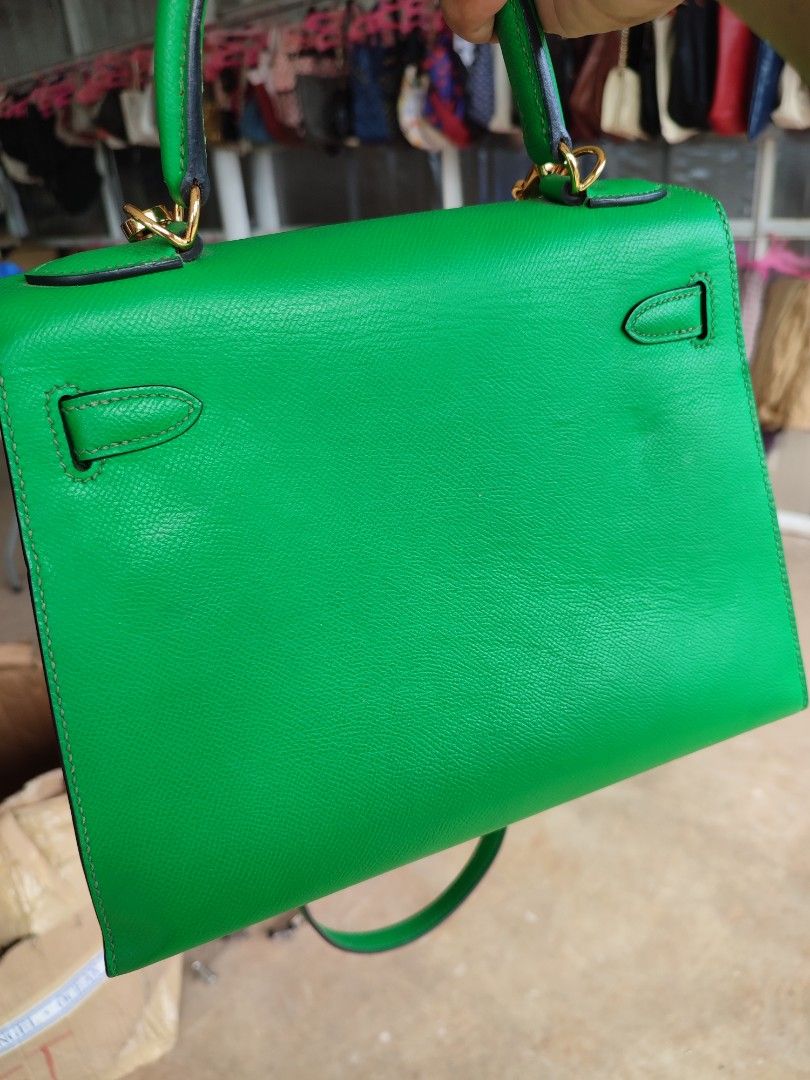 Hermes Kelly Green Leather Handbag (Category: Luxury Bags & Wallets) located in Puerto Princesa. Submitted by thriftedsoulsy2k (Listing ID 1464417893, Image 2). Description: - Vibrant bright green leather handbag - Elegant gold hardware details - Versatile top handle and detachable shoulder strap - Classic structured design, ideal for everyday or special events - Convenient size: approximately 25cm wide.