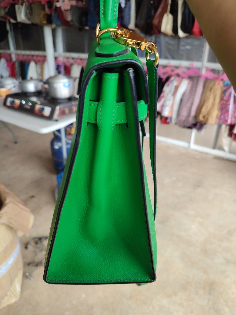 Hermes Kelly Green Leather Handbag (Category: Luxury Bags & Wallets) located in Puerto Princesa. Submitted by thriftedsoulsy2k (Listing ID 1464417893, Image 3). Description: - Vibrant bright green leather handbag - Elegant gold hardware details - Versatile top handle and detachable shoulder strap - Classic structured design, ideal for everyday or special events - Convenient size: approximately 25cm wide.