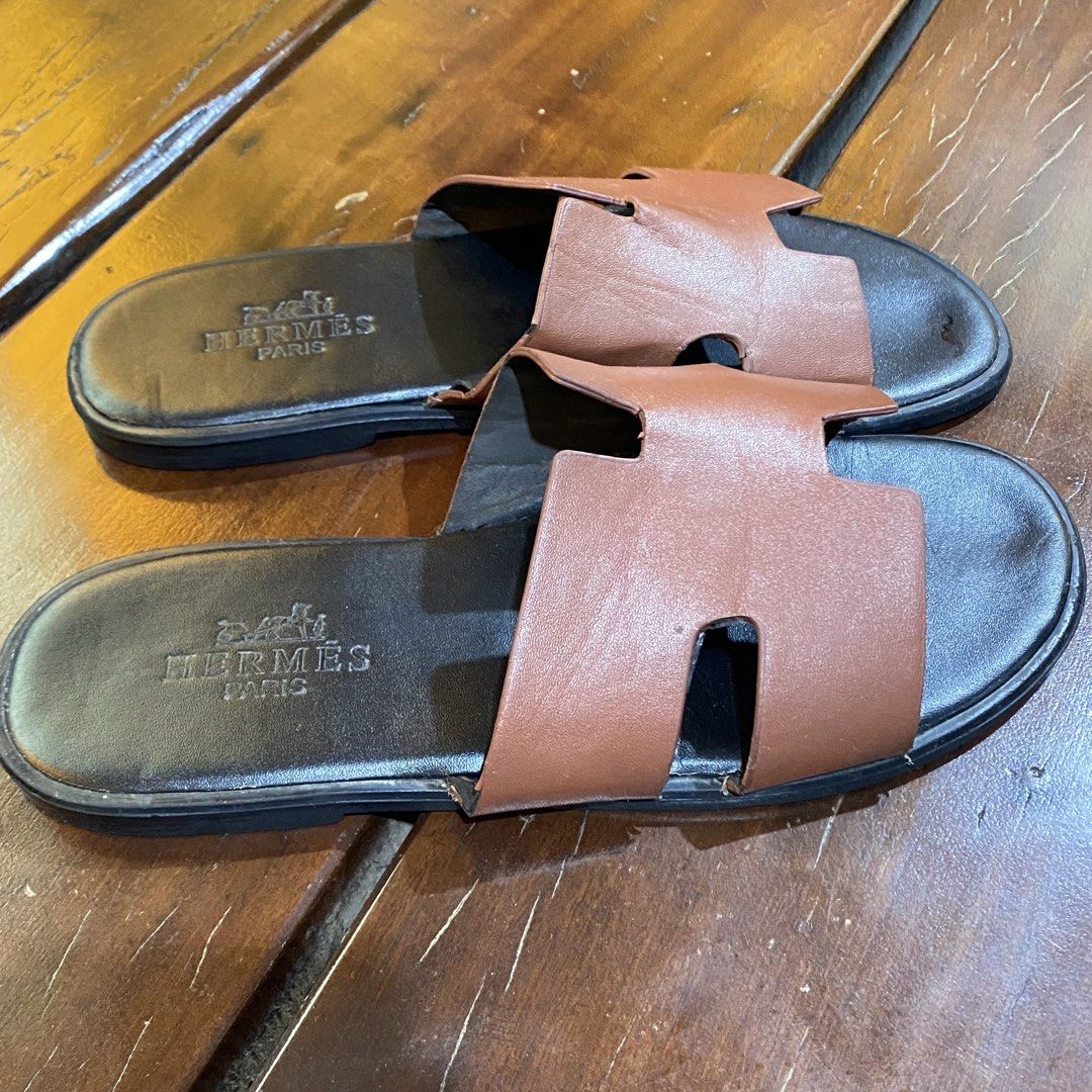 Hermes Paris Brown Leather Slides Sandals (Category: Sneakers & Footwear) located in Caloocan City. Submitted by camarcenin42067 (Listing ID 1464481322, Image 1). Description: - Authentic Hermes Paris brown leather slides - Classic H design - Comfortable slip-on style - Ideal for casual wear.