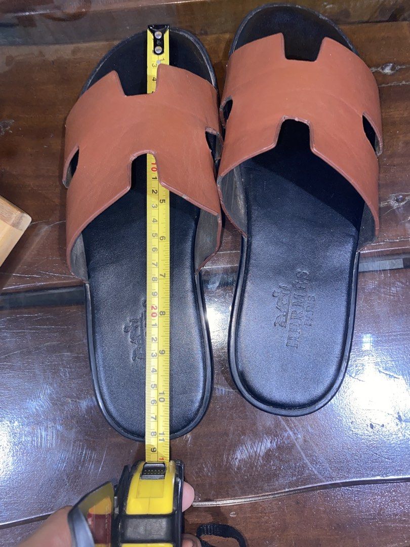Hermes Paris Brown Leather Slides Sandals (Category: Sneakers & Footwear) located in Caloocan City. Submitted by camarcenin42067 (Listing ID 1464481322, Image 3). Description: - Authentic Hermes Paris brown leather slides - Classic H design - Comfortable slip-on style - Ideal for casual wear.